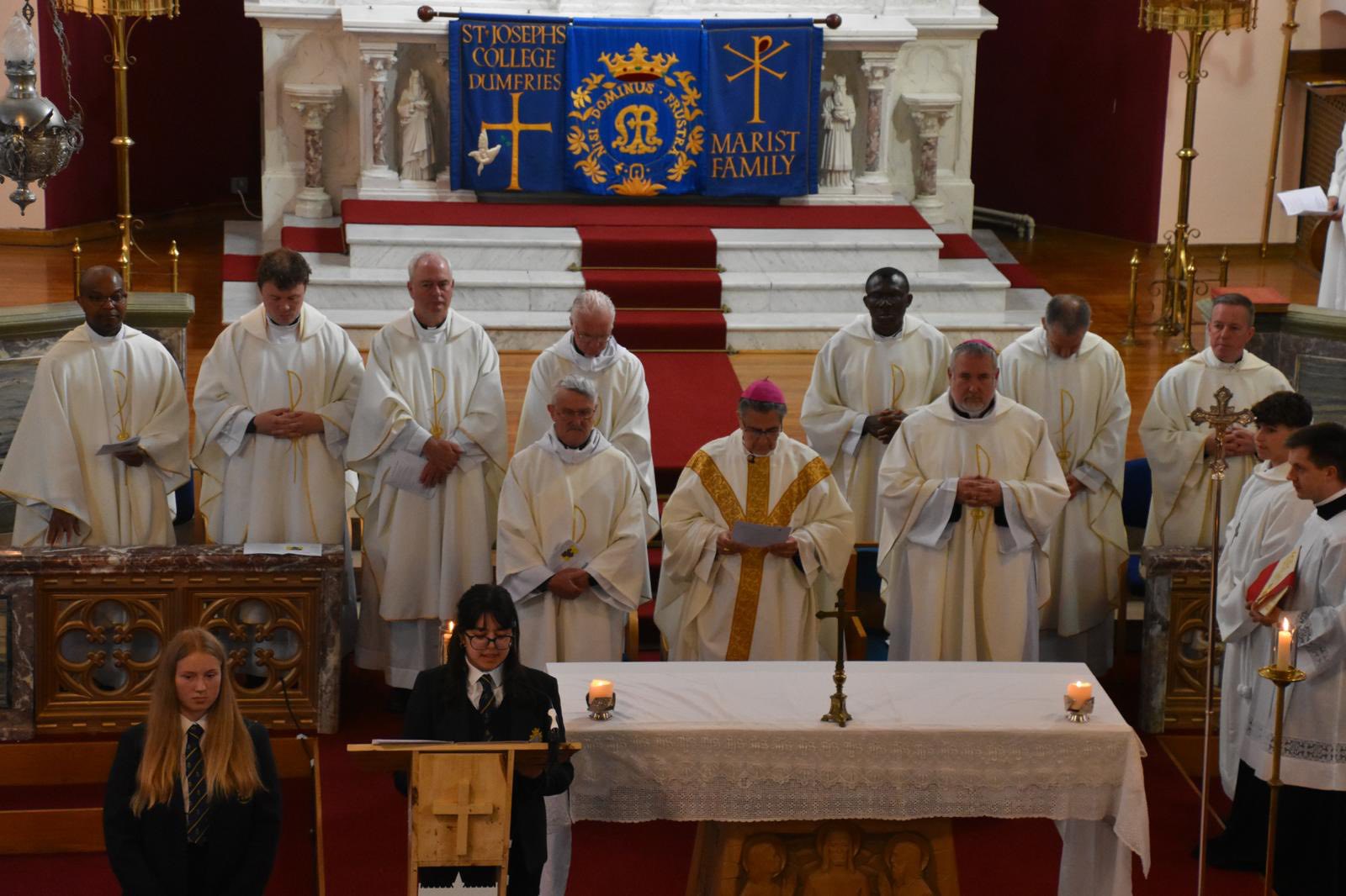 Clergy at the altar during Mass